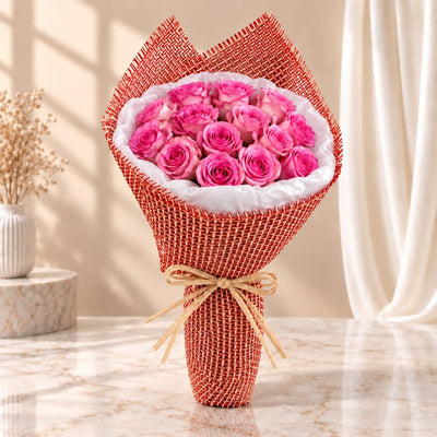 Elegant Pink Rose Bouquet With Red Woven Wrapping