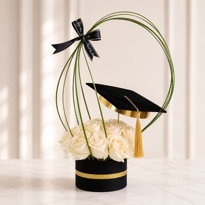 White Rose Graduation Floral Arrangement with Graduation Cap