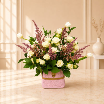 White Rose And Tulip Flower Arrangement In Decorative Pink Vase