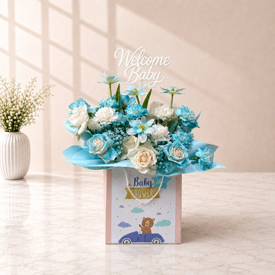Welcome Baby Boy Blue & White Mixed Flower Arrangement in Baby Gift Bag