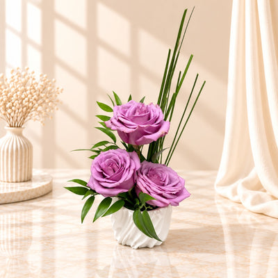 Elegant Purple Rose Flower Arrangement In White Vase